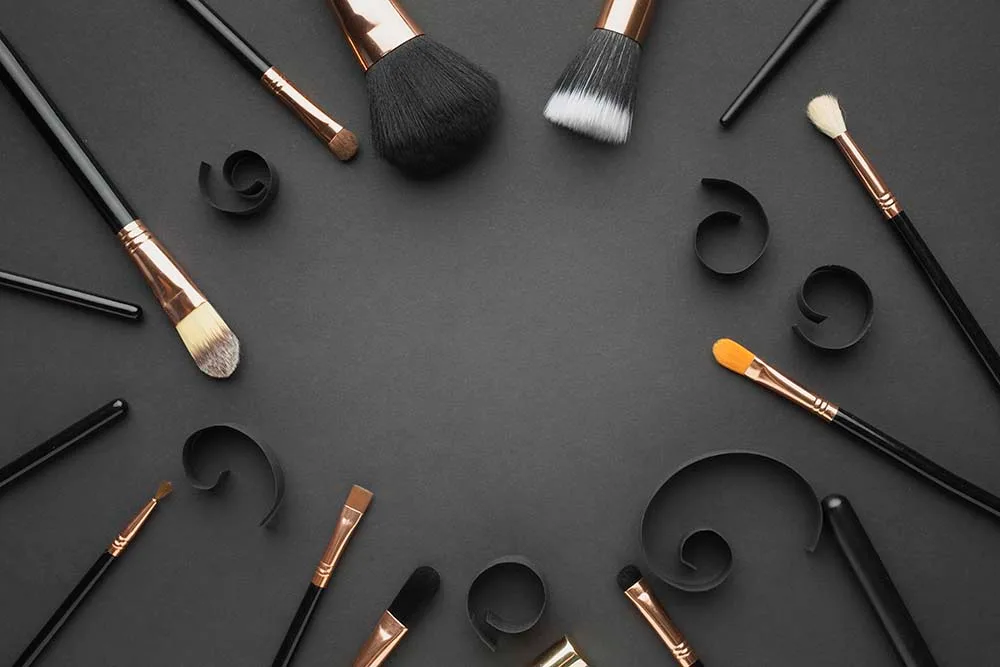 Makeup brushes with black handles and rose-gold ferrules